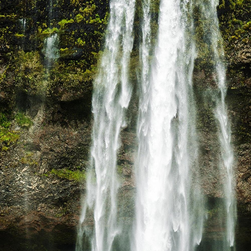 Glezna baltā rāmī - Green Waterfall In The Mountains 